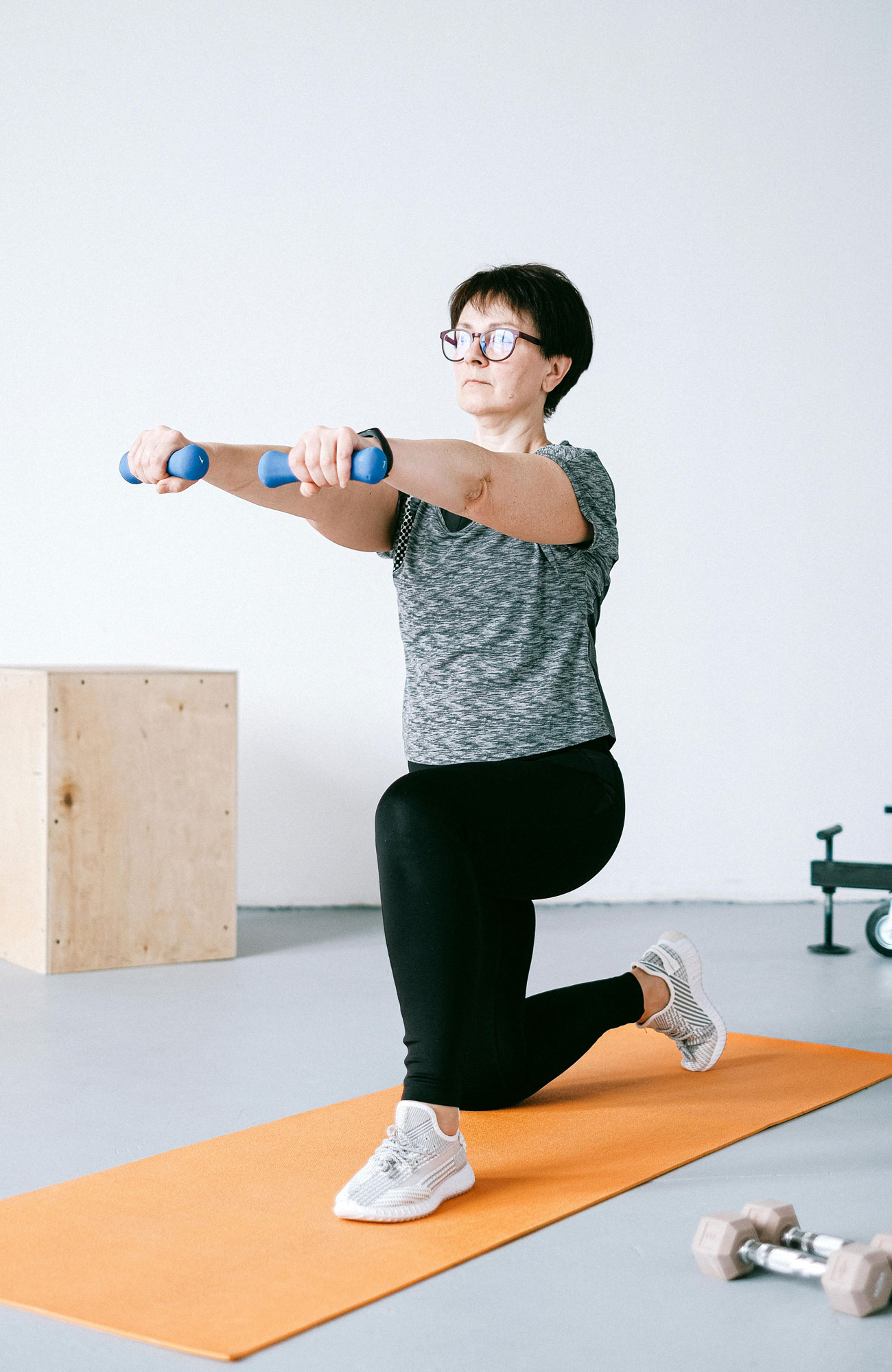 Woman Lifting Weights in Home Gym